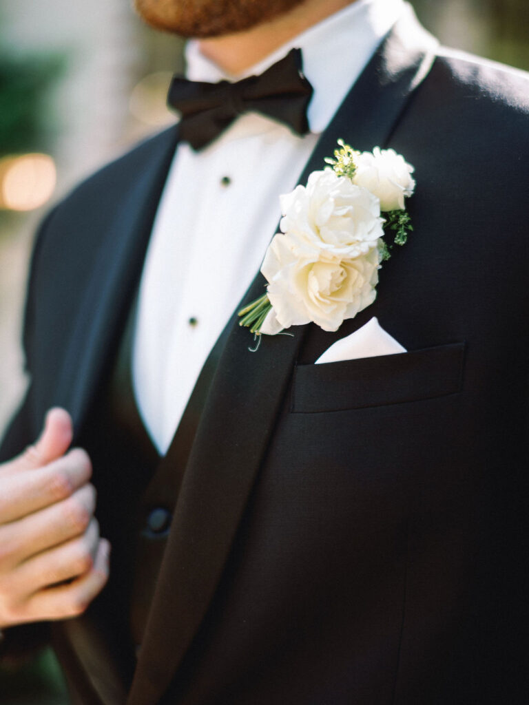 groom portraits at the peach orchard venue in the woodlands texas