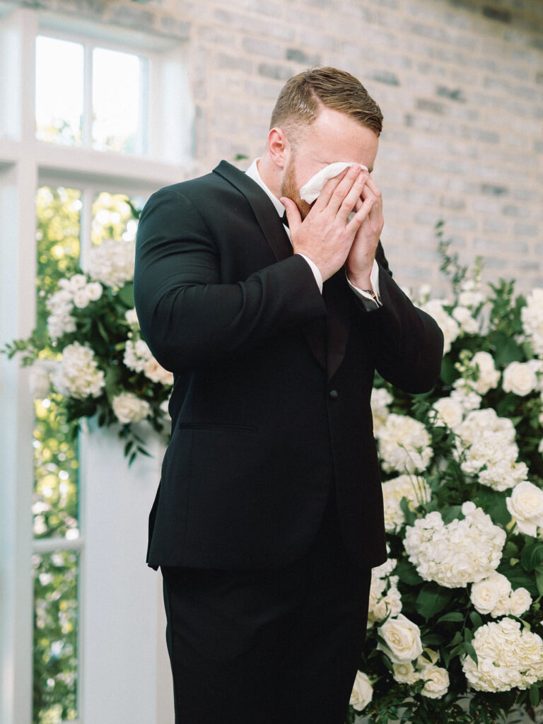 groom crying reaction to bride walking down the aisle