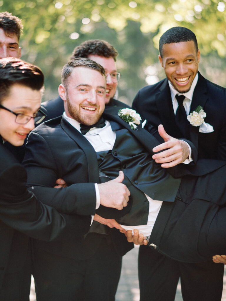 candid groomsmen photos from a film wedding photographer